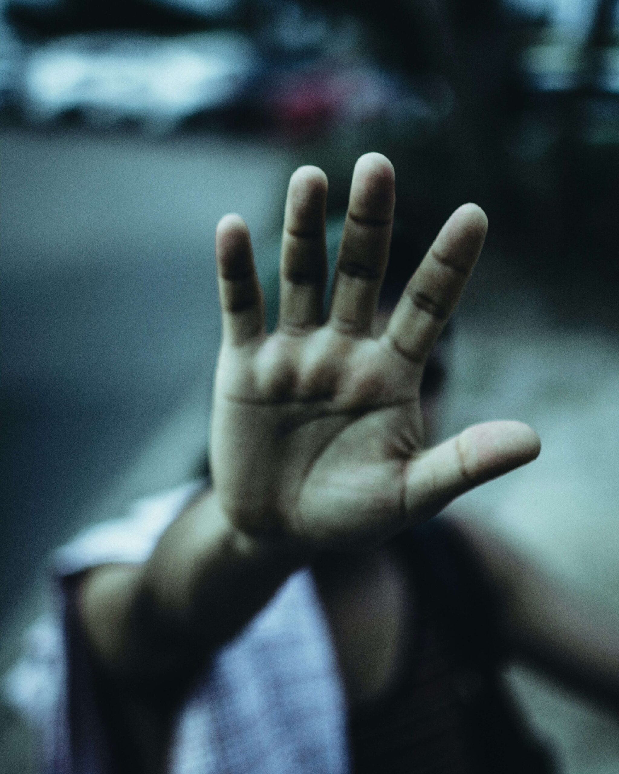 child's palm towards the camera