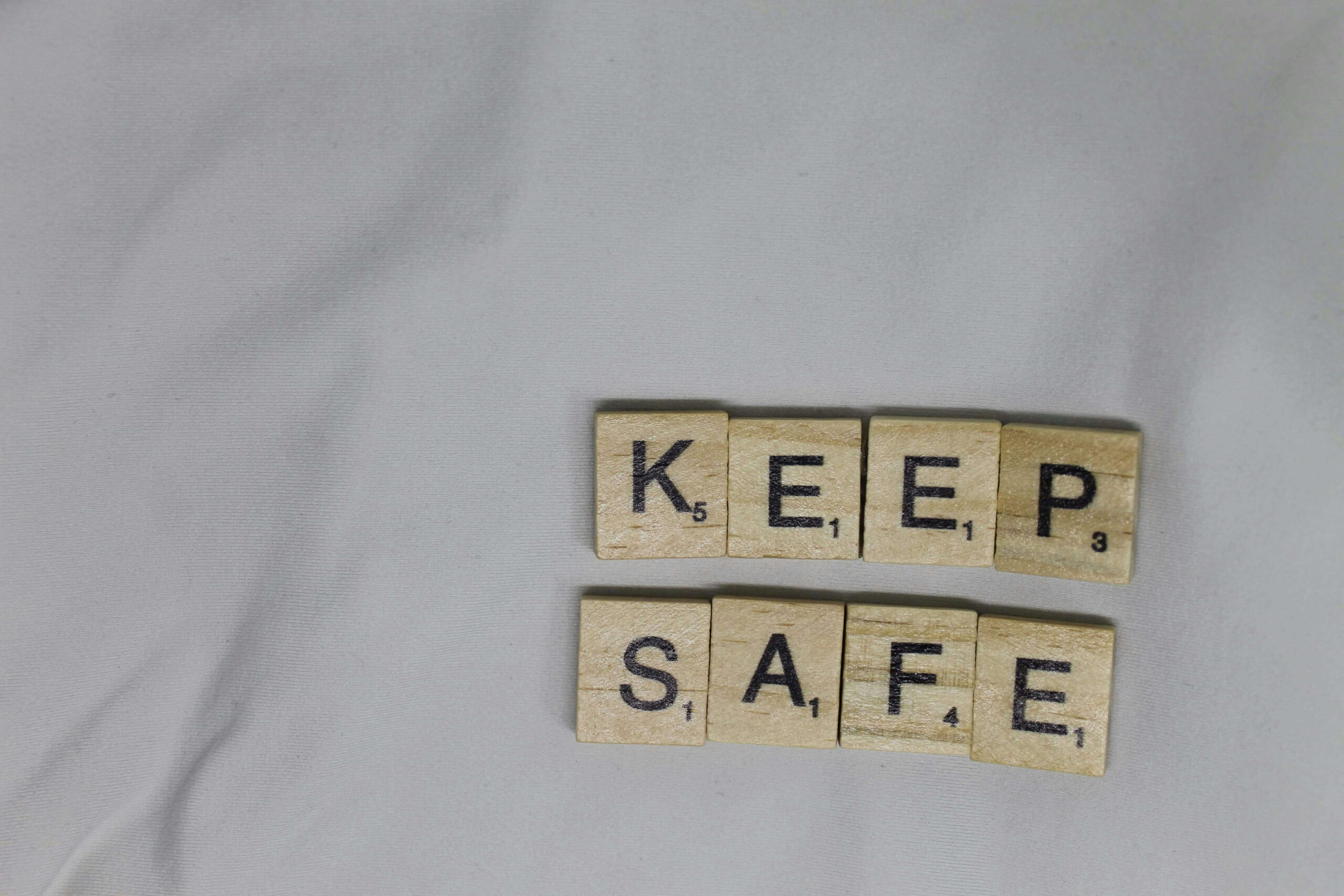 keep safe written in scabble tiles