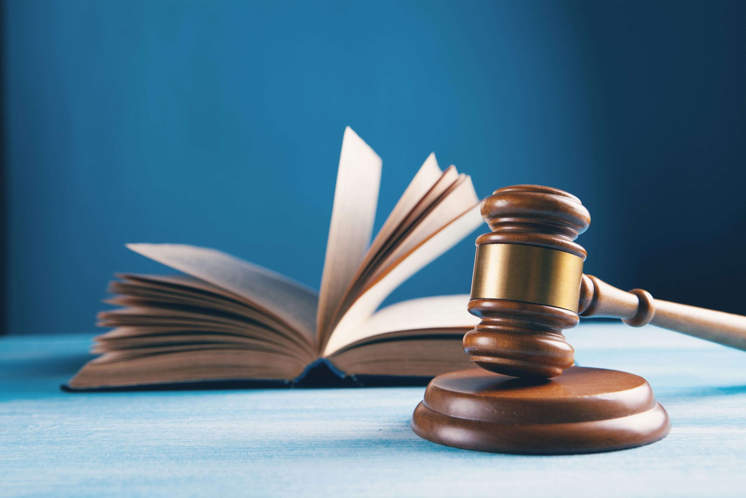open book and wooden gavel